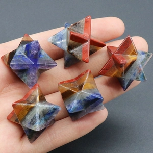 Handheld set of five Merkaba natural crystal stones with multi-colored chakra stone layers