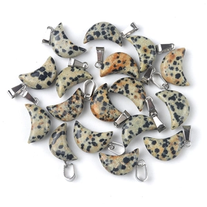 Natural dalmatian jasper moon pendants with silver metal clasps on white background