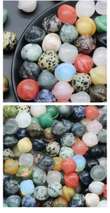 Macro shot of assorted gemstone Saturn planet figurines in various natural minerals