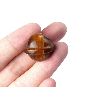 Miniature Tiger Eye crystal planet carving with Saturn rings and silky chatoyancy luster