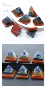 Detailed macro view of seven chakra layered natural crystal pyramid energy stone