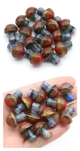 Mini gemstone mushrooms in palm showing various natural crystal textures and scales
