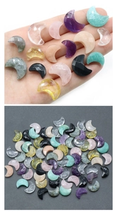 Macro detail of faceted crescent moon pendants made from amethyst and natural gemstones
