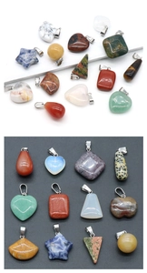 Macro shot of assorted natural crystal pendants in various geometric shapes and textures