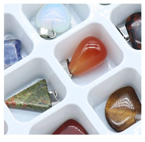 Macro shot of assorted natural crystal pendants in various shapes with silver metal clips