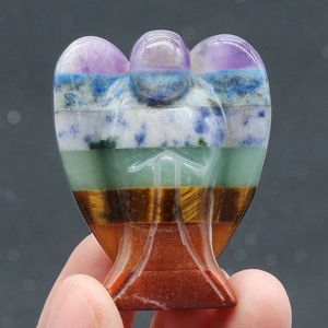 Polished natural seven chakra crystal stones carved into a mini angel statue decoration