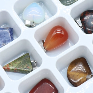 Set of natural crystal pendants in various shapes like heart, star, and drop with silver clips