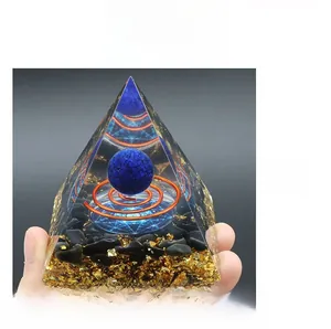 Detailed macro view of Lapis ball and copper coil inside an Orgonite Pyramid with obsidian chips