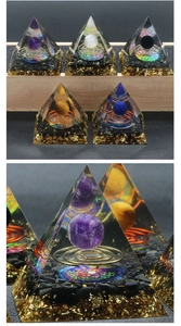 Macro shot of an Orgone pyramid with a crystal sphere, metal coil, and gold foil detail