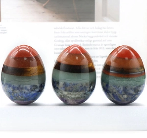 Polished egg-shaped chakra crystals featuring multi-layer natural gemstones and tiger eye