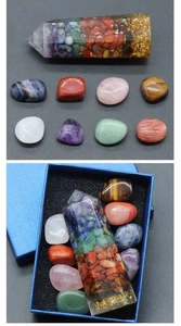 Macro detail of natural crystal healing stones and resin pillar set in a gift box