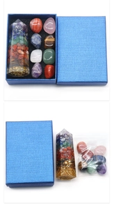 Macro view of 7 chakra orgone crystal tower with raw stones in a blue gift box
