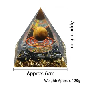 Orgone energy pyramid with tiger eye sphere, copper coil, and gold leaf base 6cm