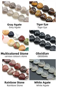 Macro details of heart-shaped polished beads in agate, tiger eye, and obsidian stones