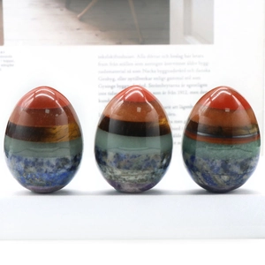 Polished 7 chakra gemstone eggs made of tiger eye and colorful stones for healing decor
