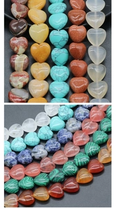 Close-up of heart-shaped natural gemstone beads with smooth finish and vertical drill holes