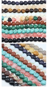 Macro shot of assorted heart-shaped semi-precious stone beads with pre-drilled holes