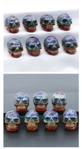 Macro detail of hand-carved natural crystal skulls featuring vibrant colorful stone layers