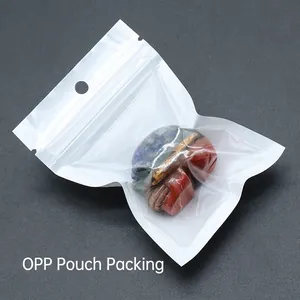Carved crystal turtle ornament made of lapis lazuli and tiger eye in an OPP bag