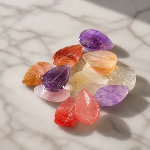 Hand-carved leaf gemstones in amethyst and rose quartz crystals in bulk OPP packaging