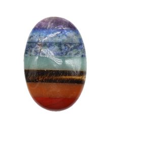 Polished oval chakra thumb stone with seven colorful layered natural healing crystals