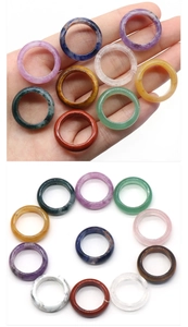 Macro view of multi-color natural crystal agate stone rings with polished smooth finish