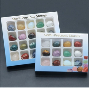 Set of twelve colorful semi-precious stone egg miniatures in decorative gift boxes