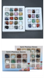 Detail of assorted mini crystal eggs set in multi-slot display box with window