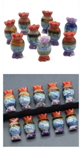 Detail of candy-shaped natural stone carving with multi-layered 7 chakra gemstone colors
