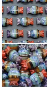 Detailed stack of natural 7 chakra stones crafted in candy shape with polished layers