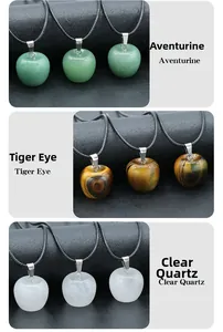 Detail of apple-shaped natural crystal pendants in aventurine, tiger eye, and clear quartz