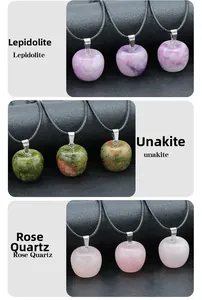 Detailed view of apple-shaped pendants in lepidolite, unakite, and rose quartz crystals