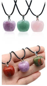 Detailed view of assorted 20mm natural stone apple pendants with woven cords
