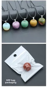 Detailed view of apple-shaped natural stone pendants and their OPP bag packaging