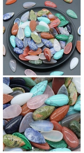 Macro shot of polished teardrop crystal cabochons showing detailed natural stone textures