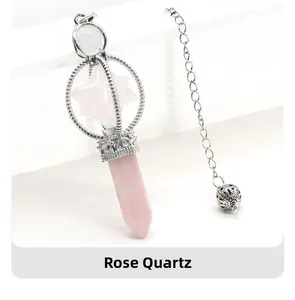 Detail view of a rose quartz Merkaba star pendulum with silver hexagonal crystal chain