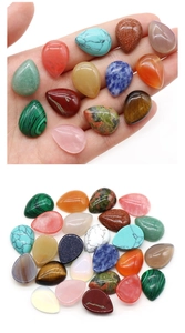 Macro view of teardrop natural crystal gemstones in various colors for jewelry making