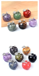 Macro shot of assorted natural crystal stone apples with rhinestone leaf and metal stem