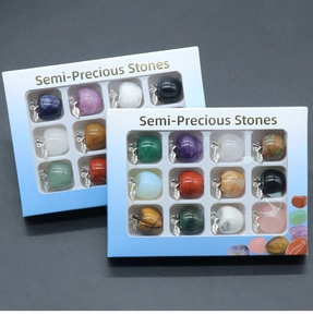 Set of 12 semi-precious stone apple pendants with silver leaf bails in a display box