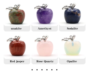 Macro shot of six varieties of natural crystal apple pendants with silver metal leaf