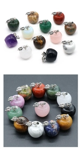 Macro detail of assorted 20mm natural crystal mini apples with silver metal leaf charms