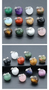 Detail of diverse 20mm crystal apple pendants with silver metal leaves in 12-piece set