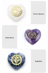Macro detail of heart-shaped chakra crystals with engraved golden energy symbols