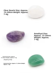 Macro detail of natural tumbled stones including Clear Quartz, Amethyst and Aventurine