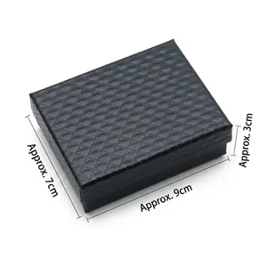 Black textured jewelry box with 9x7x3cm dimensions and elegant rhombus pattern