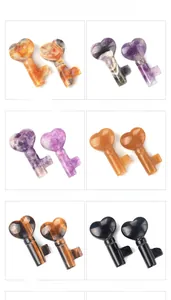 Detail showing various natural crystal heart keys in agate, amethyst, and obsidian