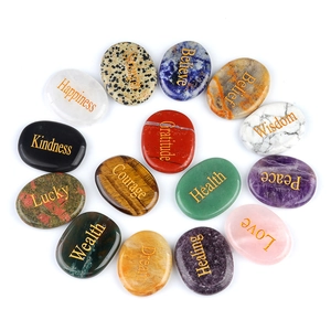 Set of 15 natural healing energy stones with engraved gold words on oval crystals