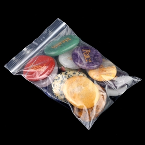 Polished natural crystal energy stones with golden gratitude and peace engravings
