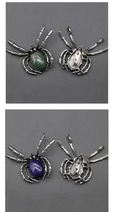 Detailed front and back view of vintage spider brooches with Indian agate and lapis stones
