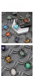 Detail view of vintage spider brooch pendant with various natural gemstone inlay settings